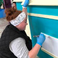 alumna painting parade float